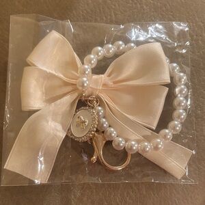 Elegant Pearl Bracelet with Bow Charm